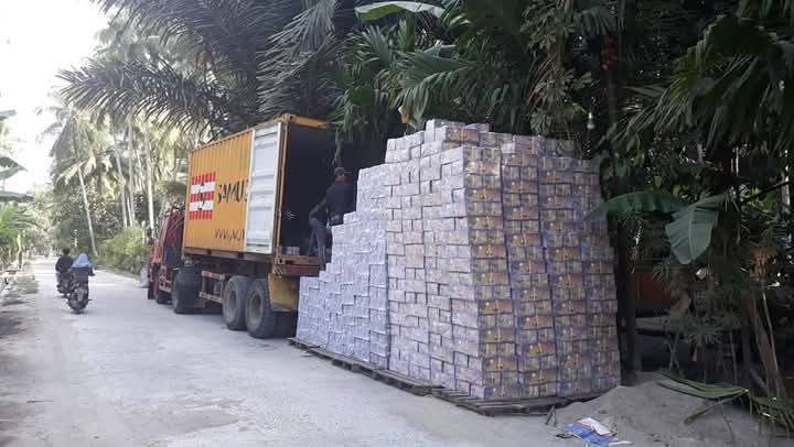 Export preparation by HSA – container loading for international delivery HSA logistics team loading coconut charcoal briquettes into a shipping container for export